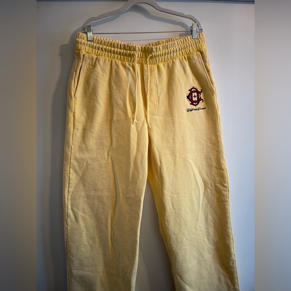 H&M Yellow Sweatpants with Red Crest Logo